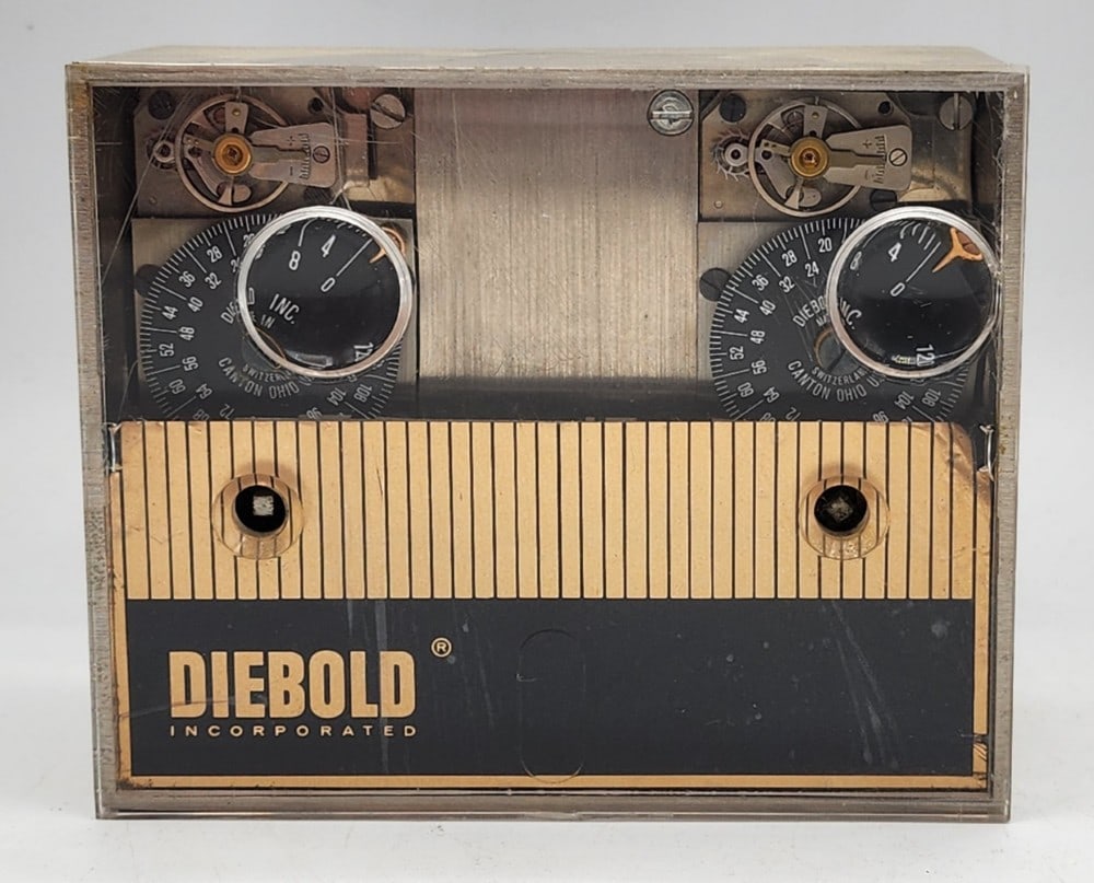 Diebold Incorporated Safe Time Lock Mechanism: Diebold is a company from Canton, Ohio. Made in Switzerland. Lock uses 2 independent watch mechanisms to lock the safe at certain times. Light wear due to use. Does not include a key. Measures approxi