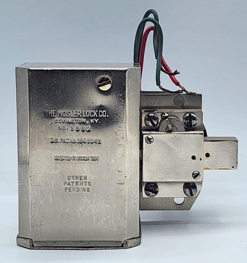 The Mosler Lock Co Safe Lock Mechanism: The Mosler Lock Co is a company from Covington, KY. Patented in Canada 1934. US PAT No. 1942045. Marked No. 3062. Light wear on metal due to age and use. Measures approximately 5_" X 5" X 5_"