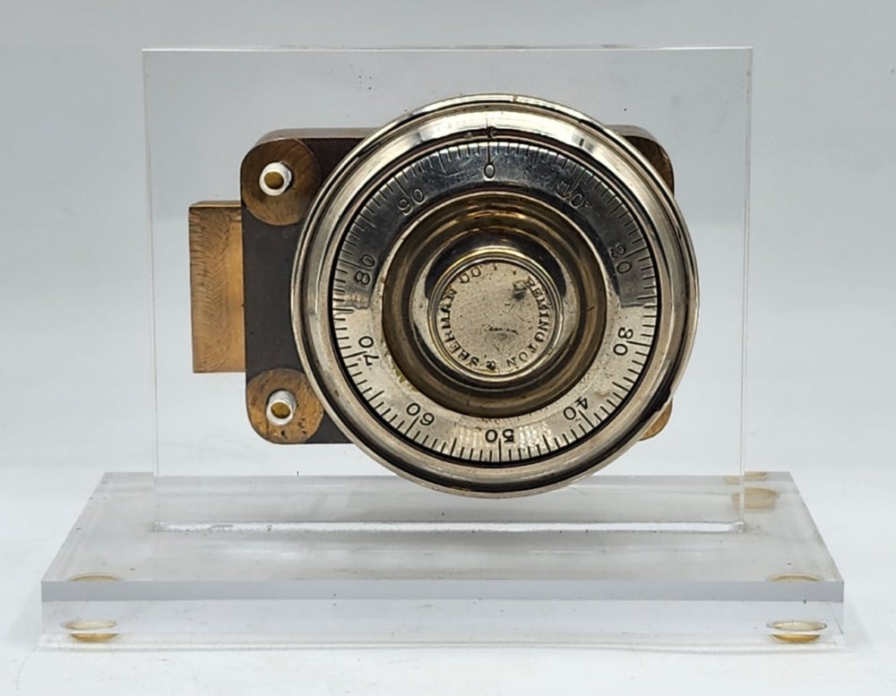 Remington & Sherman Co Safe Lock Mechanism Acrylic Display: Remington & Sherman Co was a 19th-century manufacturer based in Boston, Mass. The mechanism has a dial combination lock. There is light wear on the metal due to its age and use. Measures approximately