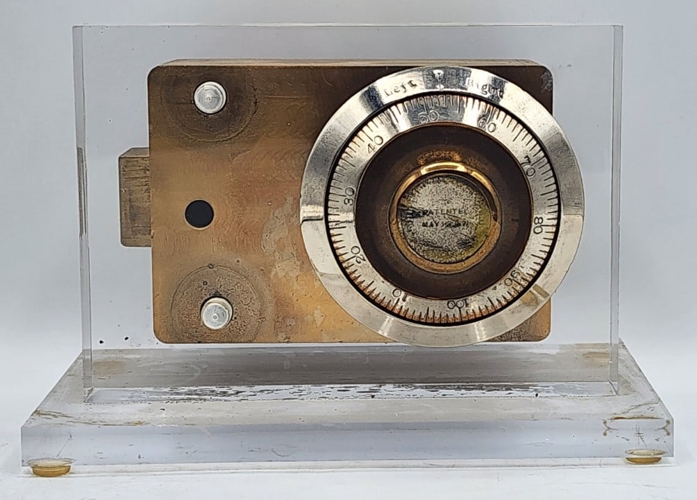 Diebold Safe Co Combination Lock Mechanism Acrylic Display: Diebold is a company from Canton, Ohio. The mechanism was patented May 23, 1871. It features a cast metal body and back plate with a dial combination lock. The lock uses a single bolt locking point sy