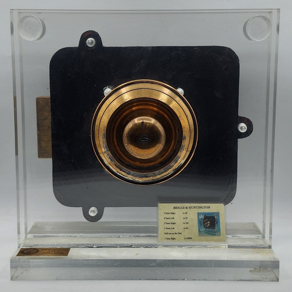 Briggs & Huntington Safe Lock Mechanism Acrylic Display: Briggs & Huntington is a company based in Rochester N.Y. The mechanism was first patented in 1857 and again in 1858. It features a dial combination lock and cast iron body. The lock uses a single bolt