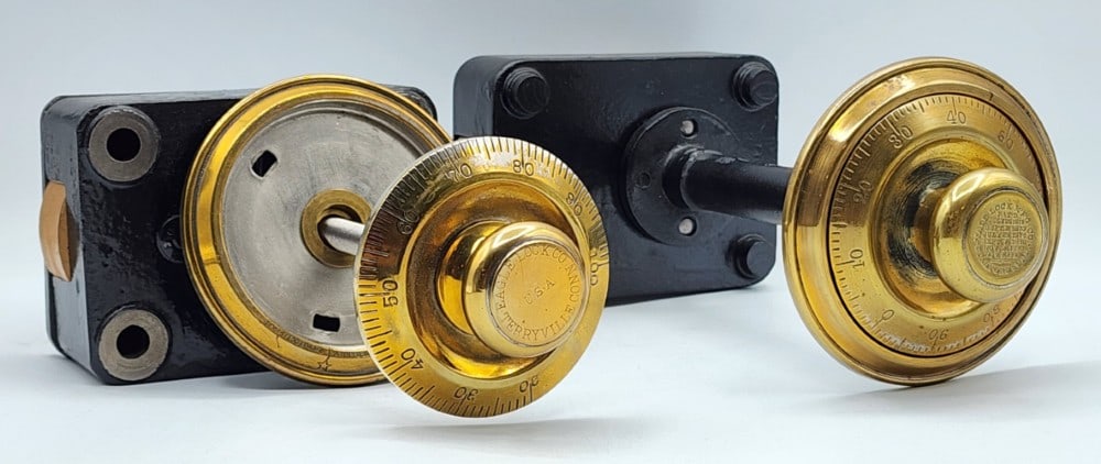 2 Combination Safe Dial Lock Mechanisms: Brands include Yale Lock Mfg Co and Eagle Lock Co. Dials are marked 0-99 and 20-100. Mechanisms are encased in black cast metal. The locks use single bolt locking point systems. Light wear due to age