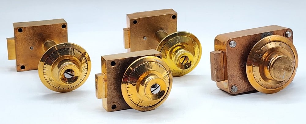 4 Safe Combination Dial Lock Mechanisms: Brands include Sargent & Greenleaf and Corbin. Dials are marked 1-50 and 1-25. The mechanisms are encased in cast metal. Locks use single bolt locking point systems. Light wear on metal due to age and