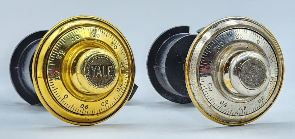 2 Yale & Towne Mfg Co Safe Combination Dial Lock Mechanisms: Yale & Towne is a company from Stamford, Connecticut. Dials are marked 0-99. The mechanisms are encased in black cast metal. Locks use single bolt locking point systems. Metal is worn with small scuff