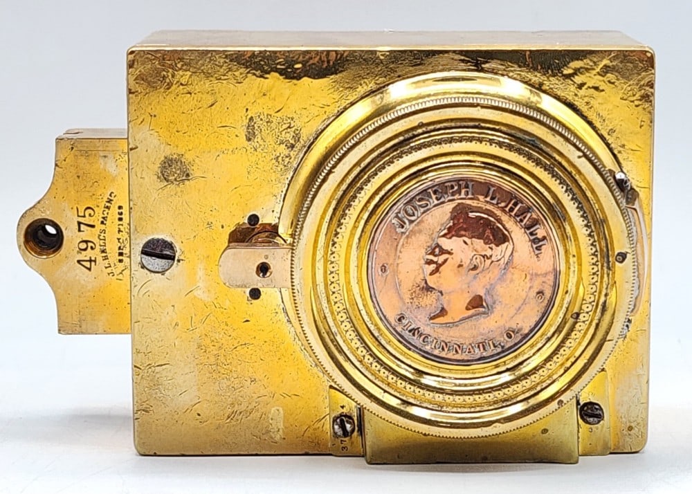 Joseph L. Hall's Safe Co Safe Lock Mechanism: Hall's is a company based in Cincinnati, Ohio. The mechanism was patented on September 7, 1869 and is encased in polished cast metal. The lock is marked 4975. Light wear and small scuffs in metal due