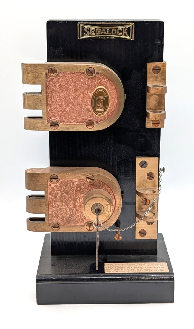 Segalock Cast Bronze Jimmy Proof Deadlock Display: Display is in nice condition with light wear from display. Overall measures 7-1/2in wide x 5in deep x 13in tall.