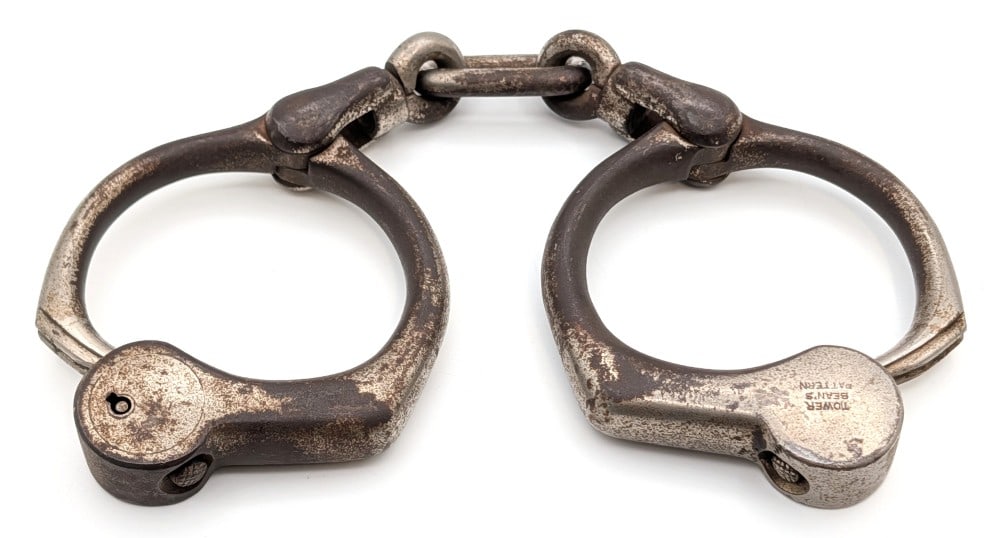 Tower Bean's Pattern Handcuffs: Tower Bean's Pattern handcuffs. No key included. Shows plating loss and wear from use and age.
