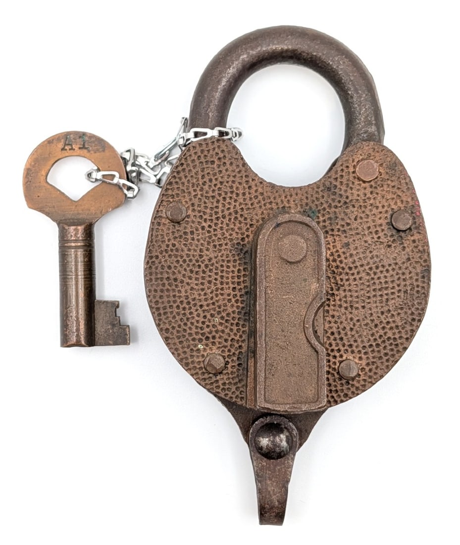 Antique Yale Padlock: Antique Yale padlock with key. The padlock shows wear from use and age. Measures approximately 4" tall.