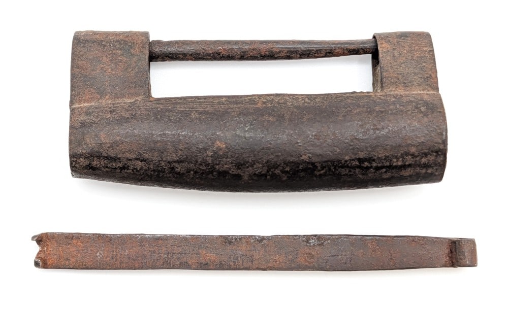 Antique Iron Shackle Lock w/ Key: Pre 1900's lock with a crude construction and unique key. Lock has surface rusting and dings from age. Measures 3-5/8in long.