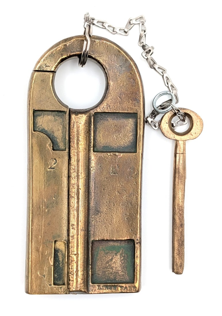 1857 Linus Yale Pin Tumbler Padlock w/ Key: A unique brass lock stamped 2 2 and 21. Lock is in good condition with pits from the casting, scuffs, and dings from use and age. Measures 4in long.