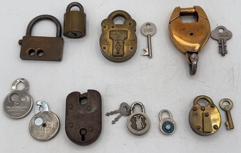 (10) Various Brand Padlocks: Brands include Junkunc, Squire, Wilson Bohannon, and other unmarked locks. Locks are all in various aged conditions with dings and wear from use and age. Largest measures 2-3/4in long.