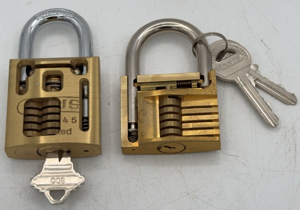 Abus No. 83/45 & 85/50 Cut Away Padlock Salesman Samples: Locks are in good condition with scuffs and wear from age and handling. Both come with the keys. Measures 3-3/8in long.