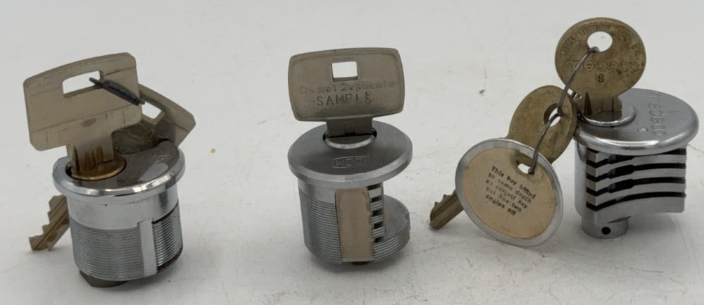 Medeco, Assa, & Dom Lock Tumbler Cut Away Salesman Samples: Locks are in good condition with scuffs and wear from age and handling. Locks come with keys.