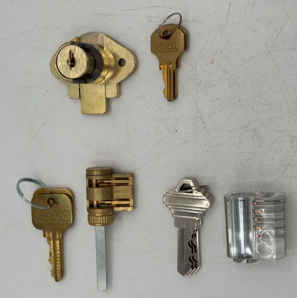 MIBA, Southord, & CCI Lock Tumbler Cut Away Salesman Samples: Locks are in good condition with scuffs and wear from age and handling. Locks come with keys.