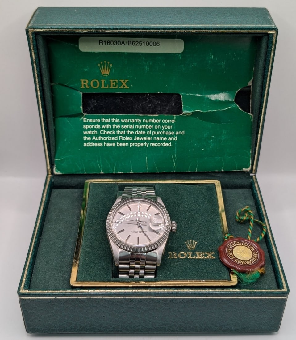 1984 Men's Stainless Steel Rolex Oyster Perpetual Datejust Wristwatch With Box: 1984 Men's Stainless Steel Rolex Oyster Perpetual Datejust Wristwatch. Watch has a stainless case and band. It features a silver dial with an automatic movement, the case measures 36mm. Comes in the o