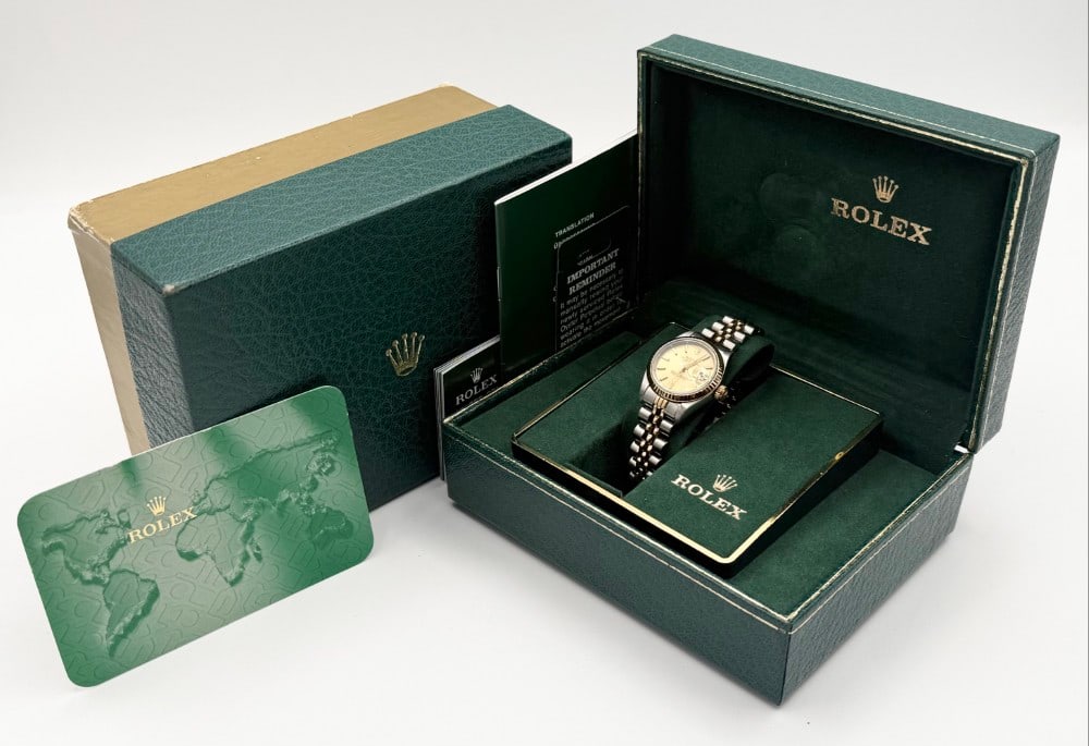 1988 Ladies Rolex Two-Tone Datejust Wristwatch In Box: 1988 Ladies Rolex Two-Tone Datejust Oyster Perpetual Wristwatch #69173. Watch and the jubilee bracelet are 18K yellow gold and stainless. It features a Champagne dial, automatic movement, and date at