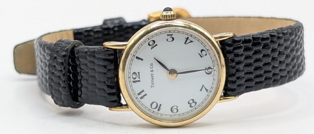 Vintage Ladies Swiss Tiffany & Co. 14k Yellow Gold Watch: Vintage Ladies Swiss Concord 14k Yellow Gold Watch. The quartz movement watch has a white face and the case measures approximately 20mm in diameter. The case is solid 14k gold and it comes with a Conc