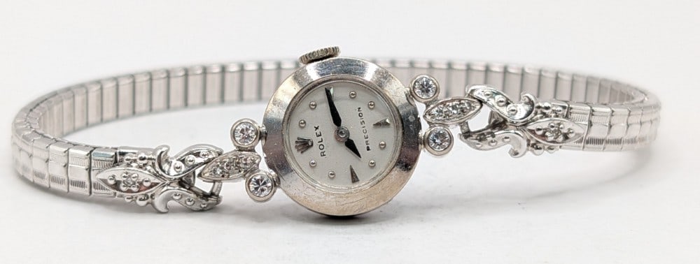 Ladies Vintage Rolex Precision 18k White Gold Diamond Wristwatch: Vintage Ladies 18k White Gold Rolex Precision Wristwatch. Watch has a 18k gold case with diamond accents and a stainless band. It features a 17 jewel mechanical movement, the case measures 15mm. Nice
