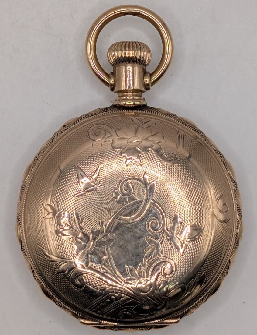 1897 Elgin Grade 109 0 Size Hunting Case Pocket Watch: 1897 Elgin Grade 109 Pocket Watch. The 7 jewel size 0 hunting case watch is in nice used condition and is running well, has some monograms on the inner dust cover. Comes in a Champion case, has a clea