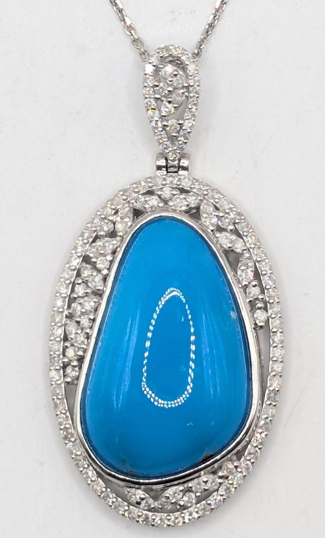 Platinum Oscar Friedman Turquoise & Diamond Pendant Necklace: Platinum designer Oscar Friedman pendant with 17.32 CT turquoise and (125) round cut diamonds totaling 0.92 CTS. Pendant is on 18" chain and total weight is 16.1 grams. Necklace comes with an AIGL app