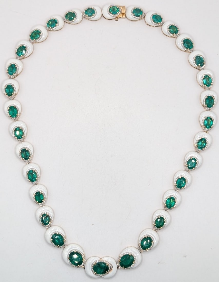 14K Gold Oscar Friedman Emerald & Diamond Necklace: 14K yellow gold designer Oscar Friedman necklace with (33) I am cut emeralds totaling 26.10 CTS and (790) round cut diamonds totaling 2.91 CTS. Necklace measures 17.5" and weighs 48.4 grams. Necklace