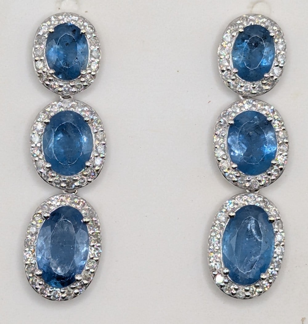 Platinum Aquamarine & Diamond Drop Earrings: Platinum drop earrings with (6) oval cut aquamarine totaling 8.83 CTS and (108) round cut diamonds totaling 1.81 CTS. Earrings weigh 11.6 grams. Earrings come with a Gemassure gemological appraisal re