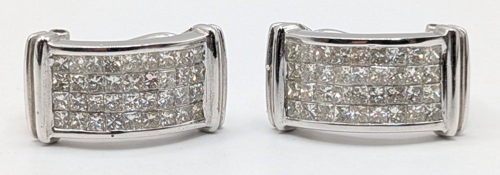 18K Gold French Clip Diamond Earrings: 18K white gold earrings with (72) square cut diamonds totaling 2.20 CTS. Total weight is 9.4 grams. Earrings come with an AIGL appraisal report with an estimated retail replacement value of $16,500.