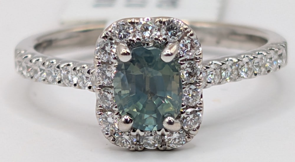 18K Gold Alexandrite & Diamond Ring: 18K white gold ring with 0.76 CT oval cut? Alexandrite and (28) round brilliant cut diamonds totaling 0.80 CTS. Ring is size 6.5 and weighs 3.1 grams.? Ring comes with a Gemassure gemological