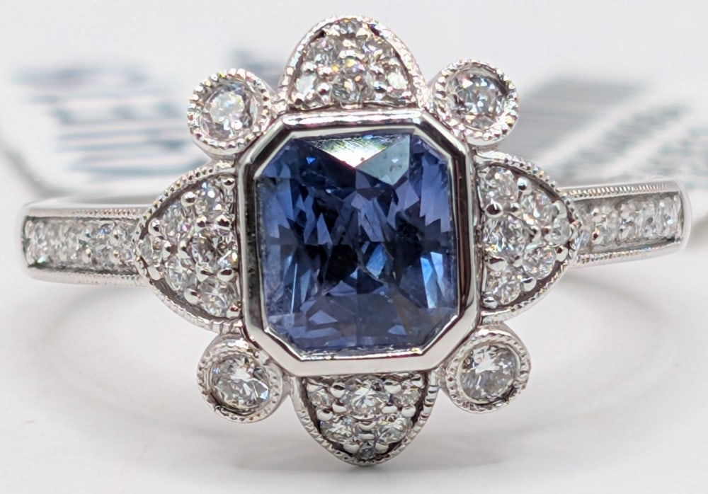 Platinum Aaron Gofflieb Blue Sapphire & Diamond Ring: Platinum designer Aaron Gofflieb ring with 1.20 CT blue sapphire and (38) round cut diamonds totaling 0.35 CTS. Ring is size 6.5 and weighs 5.5 grams. Ring comes with an AIGL appraisal report with an
