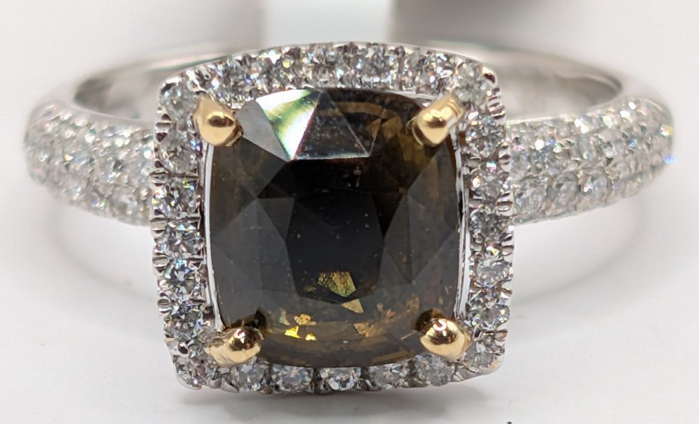 18K Gold Alexandrite & Diamond Ring: 18K two tone gold ring with 2.54 CT cushion cut Alexandrite and (114) round brilliant cut diamonds totaling 0.64 CTS. Ring is size 6 and weighs 5.7 grams. Ring comes with a Gemassure gemological