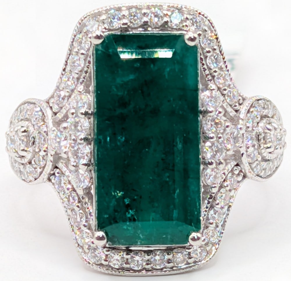 Platinum Oscar Friedman Emerald & Diamond Ring: Platinum designer Oscar Friedman ring with 4.02 CT octagonal cut green emerald and (68) round brilliant cut diamonds totaling 0.73 CTS. Ring is size 6 and weighs 7.8 grams. Ring comes with an AIGL