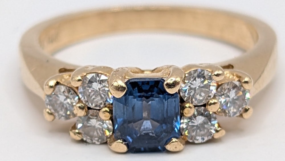 14K Sapphire & Diamond Ring: 14K yellow gold ring with emerald cut blue sapphire and round cut diamond accents. Ring is size 6 and weighs 3.4 grams.