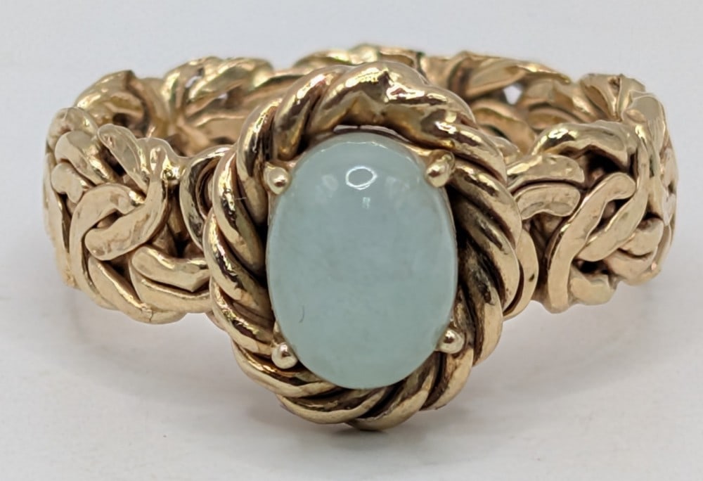 14K Gold Jade Ring: 14K yellow gold byzantine shank ring with oval jade cabochon. Ring is size 7 and weighs 3 grams.