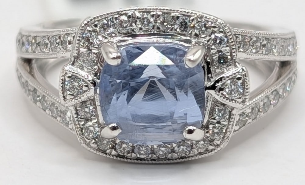 Platinum Cushion Cut 3.08 Carat Blue Sapphire & Diamond Ring: Platinum ring with cushion cut 3.08 carat light blue sapphire and (54) round cut .39 ctw diamonds. The ring comes with a GGA gemological report and a GIA gemological report for just the blue sapphire.