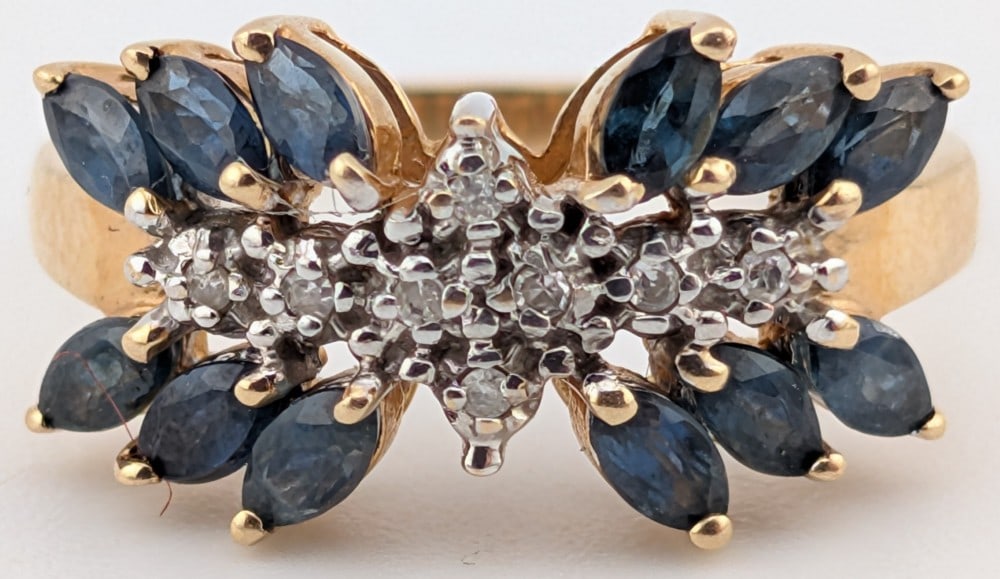 10K Gold Blue Sapphire & Diamond Ring: 10K yellow gold ring with marquis cut dark blue sapphires and diamonds. Ring is size 6.5 and weighs 2.8 grams.