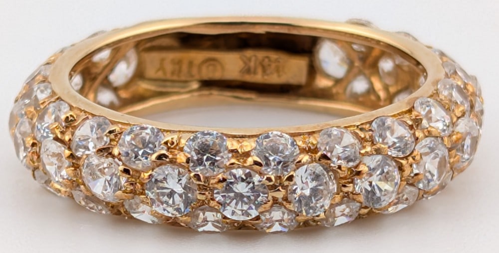 14K Gold Pave Set Diamond Ring: 14K rose gold ring with 3 rows of round cut pave set diamonds. Ring is size 7 and weighs 4.3 grams.