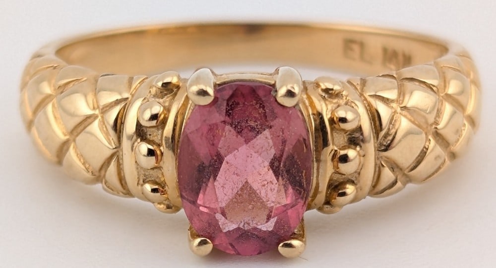 14K Gold Ruby Solitaire Ring: 14K yellow gold ring with oval cut ruby solitaire. Ring is size 9 and weighs 3.8 grams.
