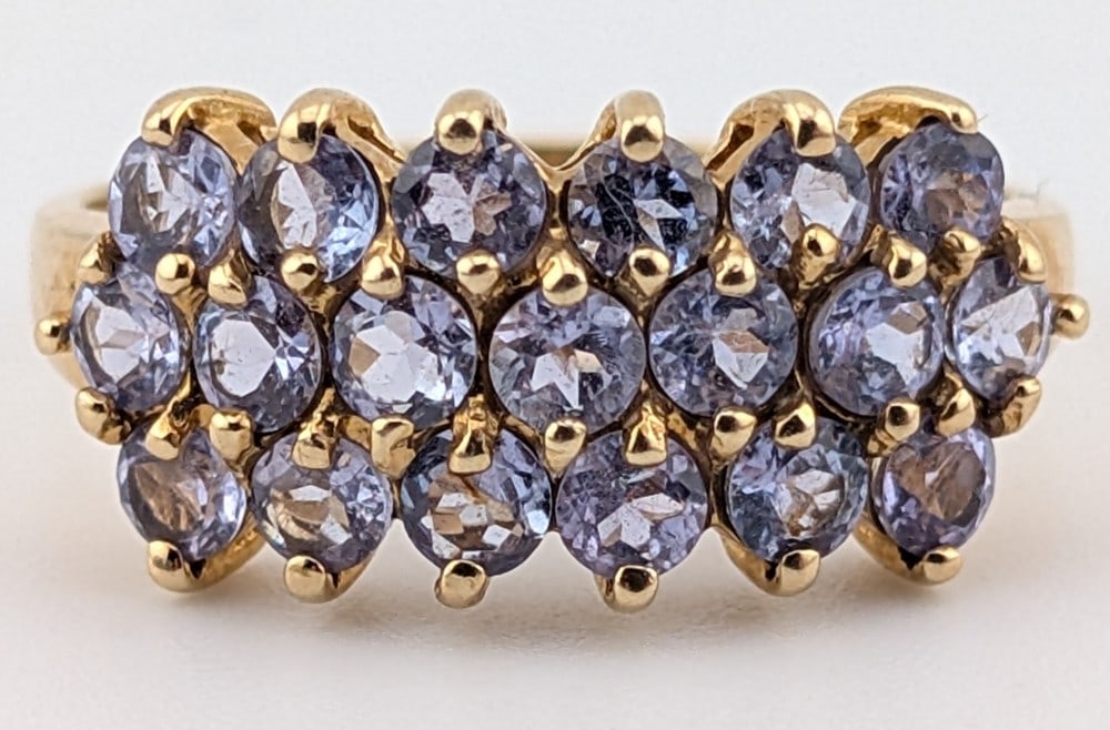 10K Triple-Row Tanzanite Ring: 10K yellow gold ring with three rows of round cut Tanzanite. Ring is size 9 and weighs 3.6 grams.