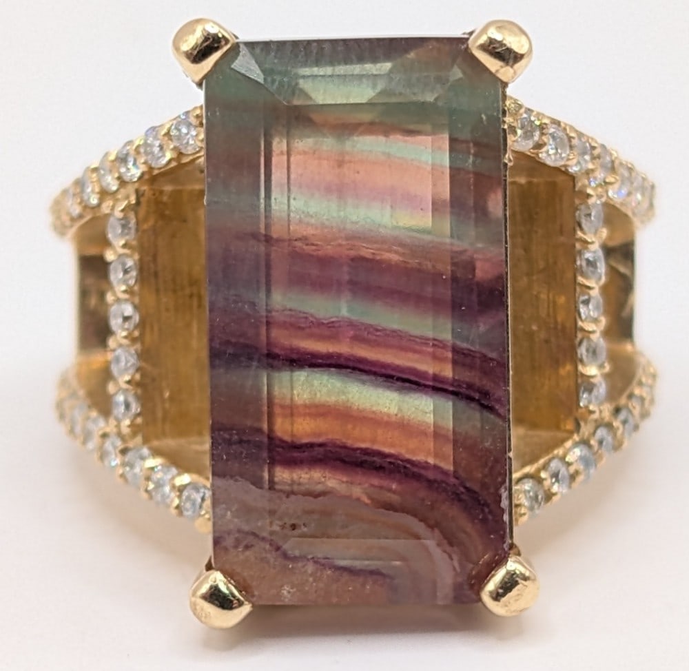 18K Gold Emerald Cut Tourmaline & Diamond Ring: 18K yellow gold ladder shank ring with large emerald cut tourmaline stone and diamonds on the ladder shank. 9.8 DWT. Ring is size 7 and weighs 15.2 grams.