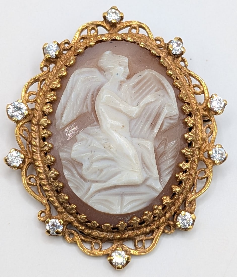 14K Gold Antique Angel Cameo & Diamond Brooch: Antique 14K yellow gold framed shell cameo angel with diamonds. Brooch measures 1.5" by 1.4" and weighs 11.5 grams.
