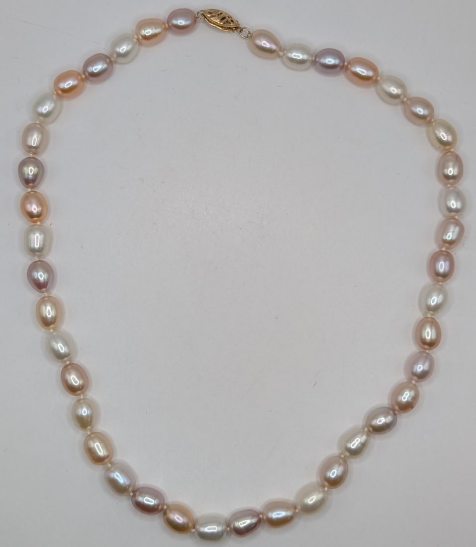 14K Gold Clasp Pink & white Pearl Necklace: 14K yellow gold clasp with hand tied pink and white pearls. Measures 16"