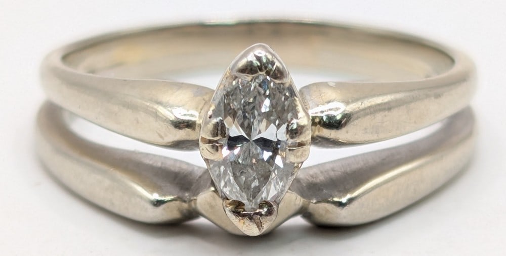 18K Gold Marquis Diamond Bridal Set Ring: 18K white gold bridal set with 0.35 CT marquis diamond. Ring is size 7 and weighs 4.63 grams. Ring is appraised at $4,200.