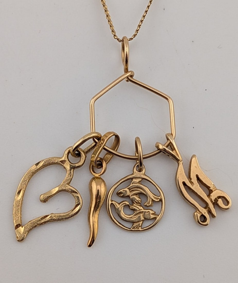 14K Gold Charm Pendant Necklace: 14K yellow gold charm pendant on 22" 14K yellow gold chain. Total weight is 4.3 grams.