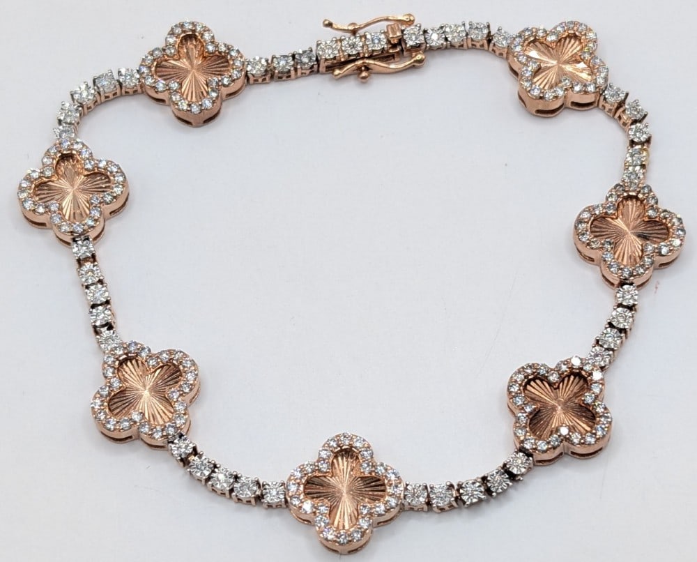 10K Rose Gold Diamond 2.00 Ctw Clover Link Bracelet: 14K rose gold clover link tennis bracelet with 2.00 ctw diamonds. Bracelet measures 7" and weighs 14.8 grams.