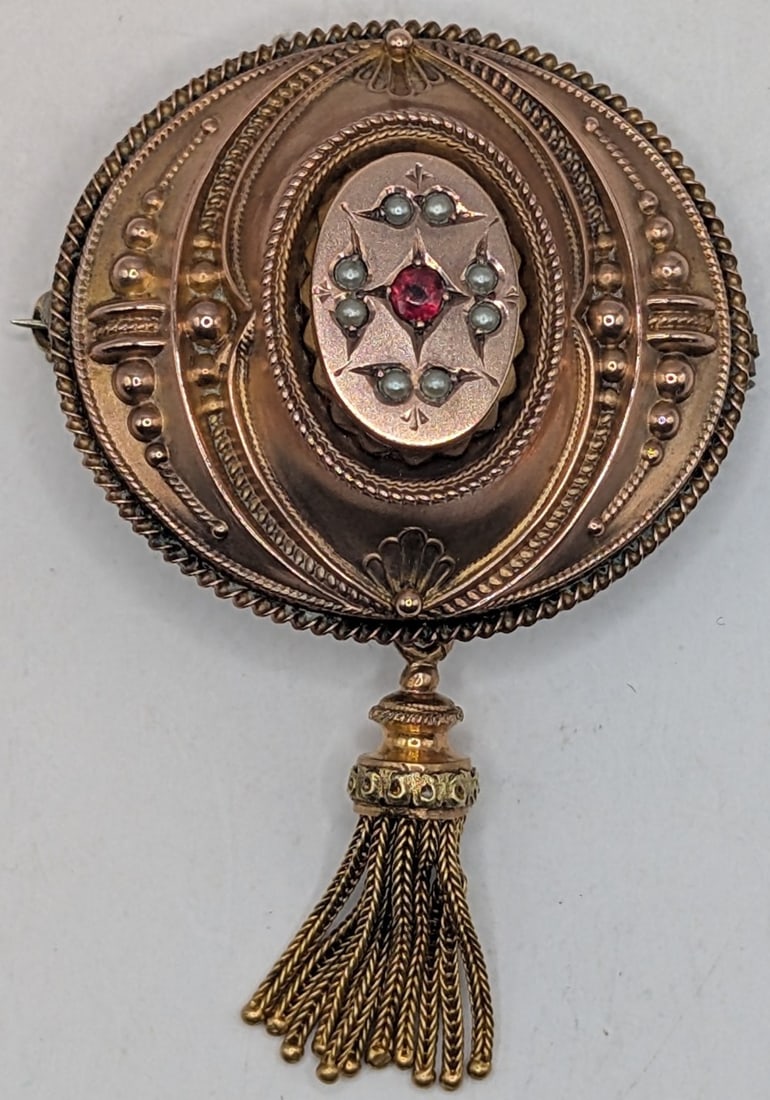 10K English Gold Brooch W/Ruby & Pearls: Vintage 10K yellow English Gold Brooch with ruby and pearls. Has old photo in back. Measures 1.5" and weighs 8.8 grams.