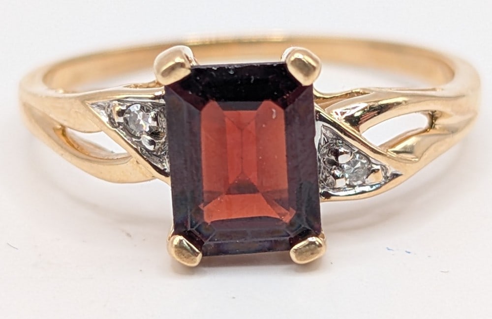 14K Gold Ruby & Diamond Ring: 14K yellow gold ring with emerald cut ruby and diamond accents. Ring is size 8 and weighs 2.5 grams.