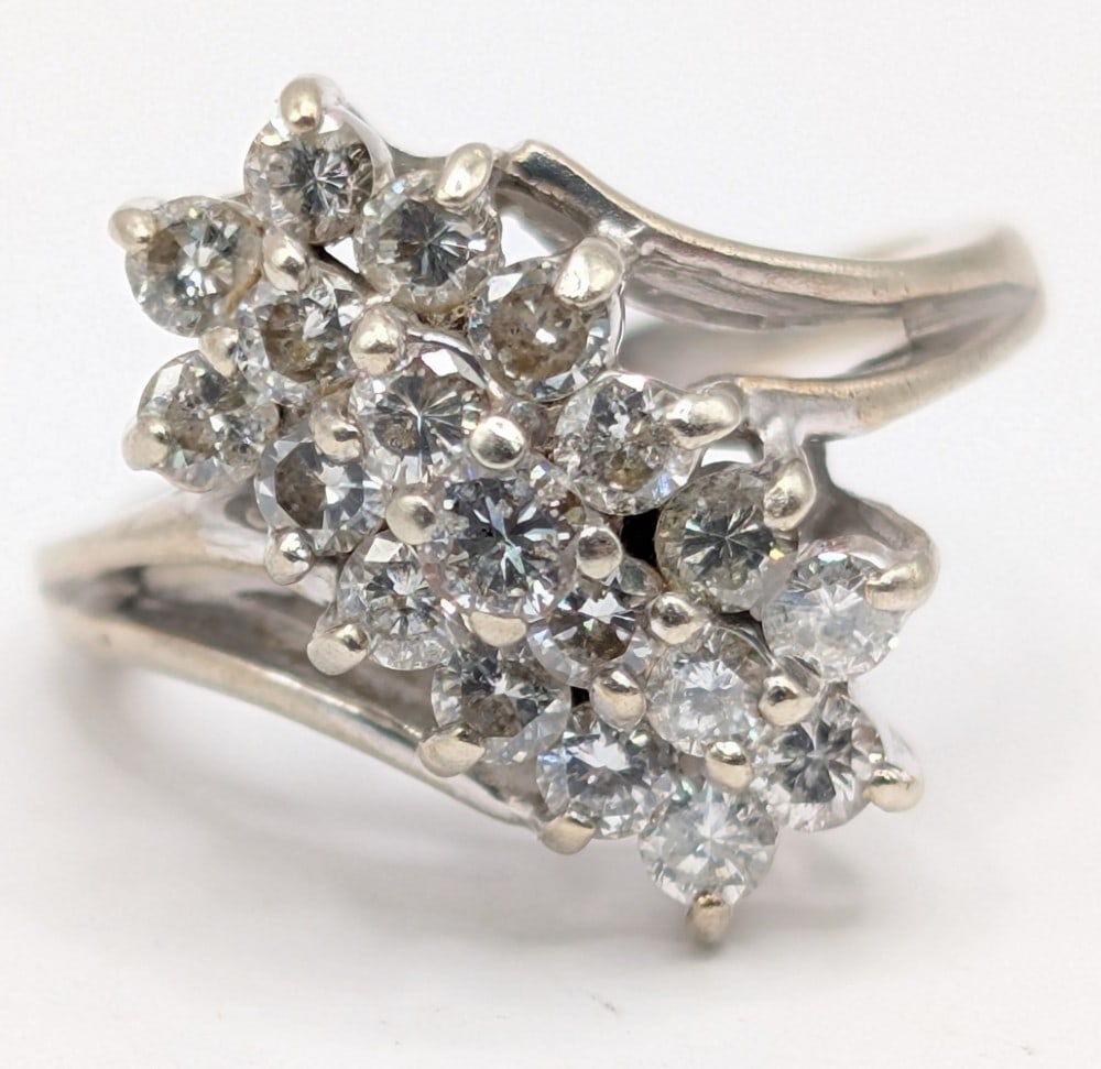 14K Gold Diamond Cluster Ring: 14k yellow gold ring with round cut diamonds in a wave cluster. Ring is size 4 and weighs 4.7 grams.