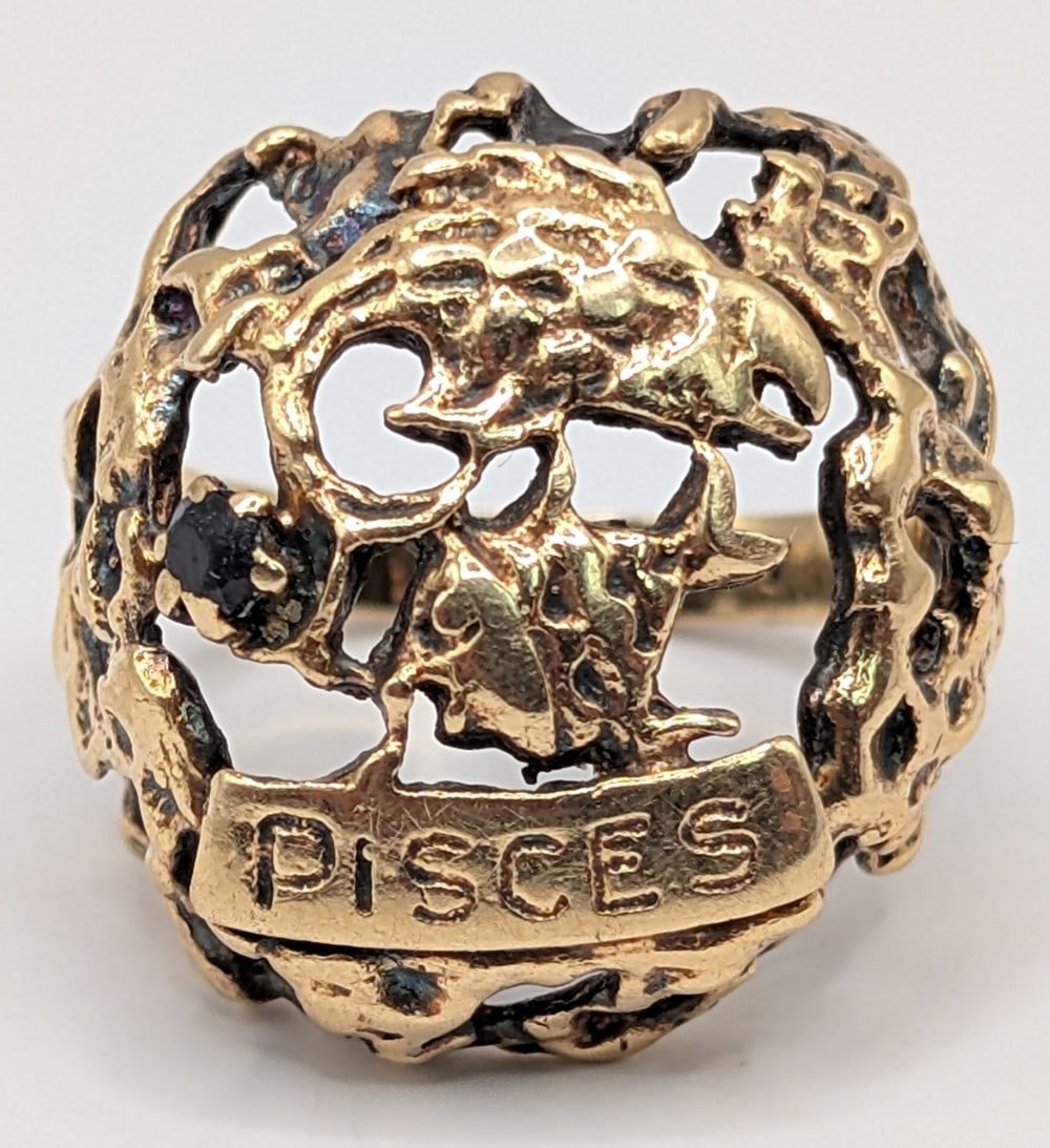 14K Gold Brutalist Style Pisces Ring: 14K yellow gold brutalist Pisces ring with blue sapphire.? Ring is size 7 and weighs 8.3 grams.