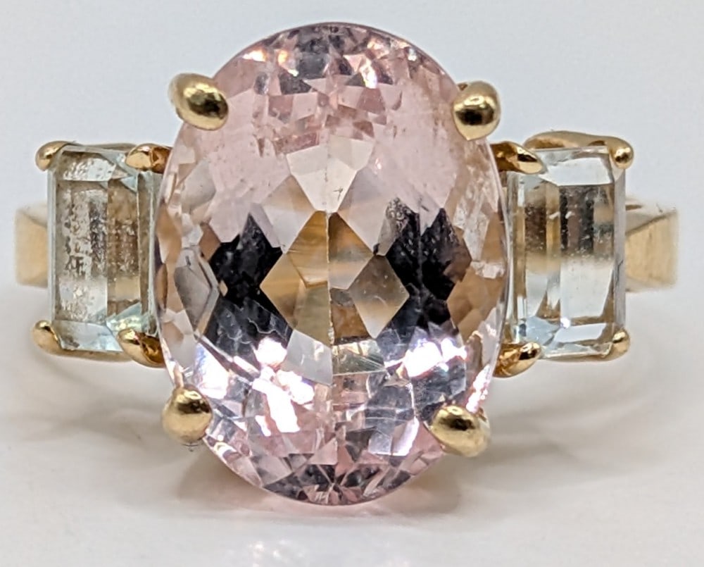 14K Gold Pink Morganite Ring: 14K yellow gold ring with large oval pink morganite and two aquamarine accents. Ring is size 7.5 and weighs 5.2 grams.