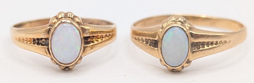 Lot of (2) 10K Gold Opal Rings: Lot of (2) 10K yellow gold rings with oval cabochon opal. Size 6 and 3.5. Total weight is 2.9 grams.